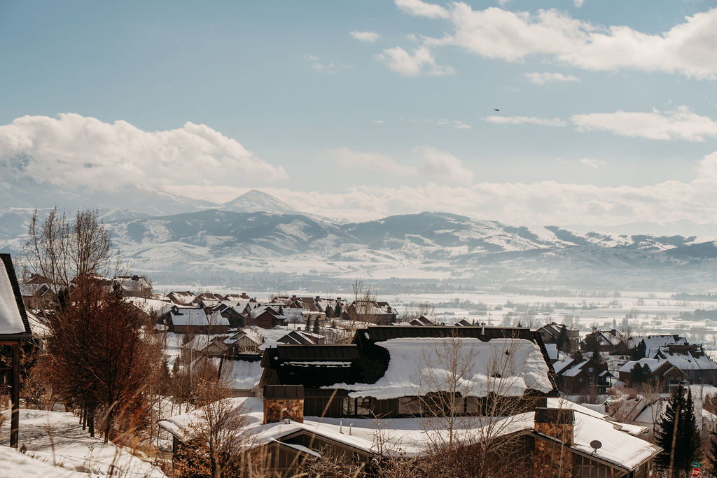 View of mountain backdrop featuring nearby suburban area