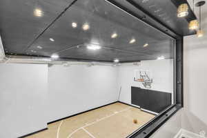 Unique indoor sport court located beneath the garage