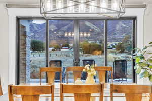 Dining area positioned to capture spectacular mountain views, creating a stunning backdrop for everyday meals and special gatherings.