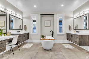 The spa-inspired primary bathroom offers a relaxing escape with elevated finishes and a calming, retreat-like feel.