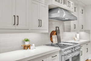 Central kitchen designed for function and flow, featuring custom cabinetry, a large island, and mountain views.