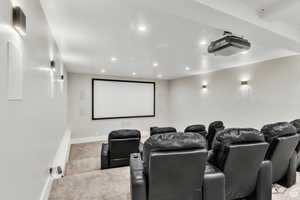 Dedicated theater room with tiered seating, creating an immersive, cinema-style experience right at home