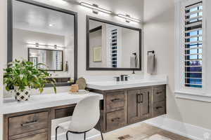 Spa-inspired primary bathroom featuring dual vanities