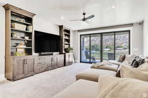 Spacious upstairs TV room with custom built-in shelving, offering the perfect space for relaxing or entertaining.