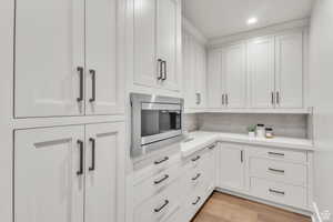 Includes a hidden butler’s pantry for added convenience and storage.