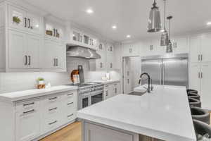Anchoring the home, this thoughtfully designed kitchen combines function and style with custom cabinetry, an expansive island, and scenic mountain views.
