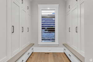 Conveniently located just off the garage, this functional mudroom and drop zone offers the perfect space for organization and everyday living,