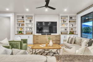 Situated at the heart of the home, this inviting living room seamlessly connects to the kitchen, creating an ideal space for both everyday living and entertaining.