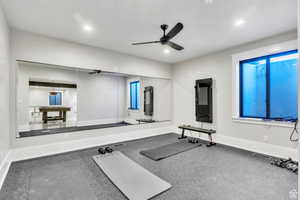 Private home gym featuring a full wall mirror and built-in water fountain designed for convenience, performance, and an elevated at-home fitness experience.