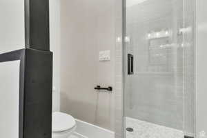 Full bathJack-and-Jill bath with dual sinks and custom metal-framed mirrors by a local artist, offering both convenience and unique design.room with shower