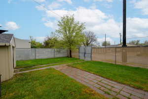 Fenced backyard with a gate