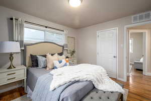Bedroom with wood finished floors