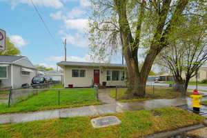 View of front facade featuring a fenced front yard and entry steps
