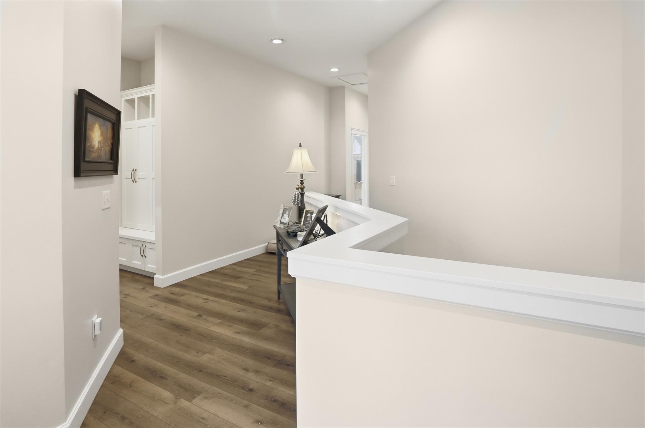 Hallway featuring dark wood-style floors and recessed lighting