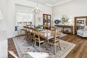 Dining room featuring a chandelier and dark wood-style floors