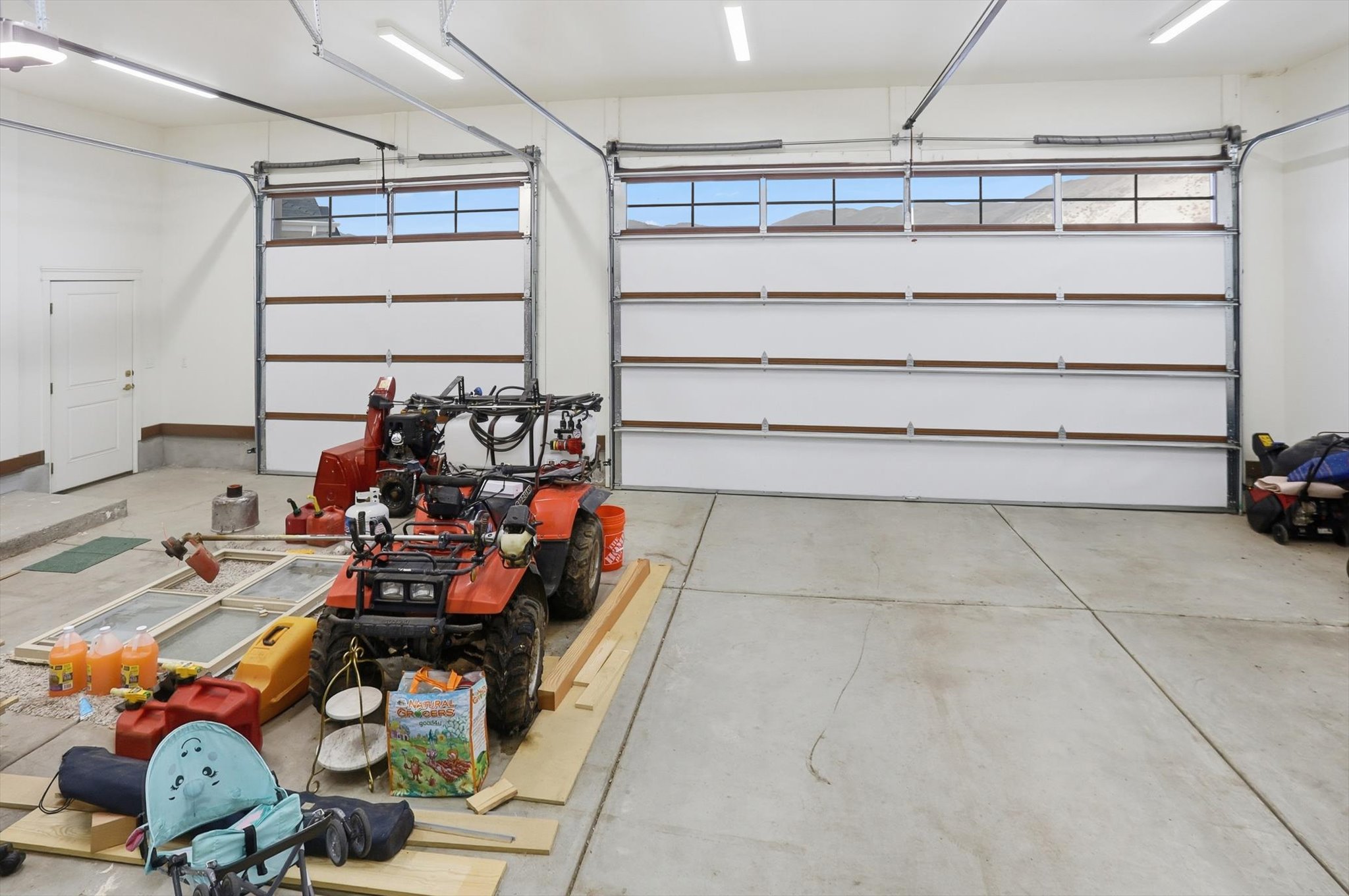 Garage featuring a garage door opener