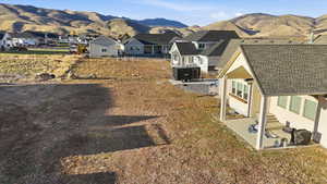 View of yard featuring a patio area, a mountain view, and a residential view
