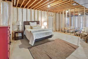 Bedroom featuring concrete floors