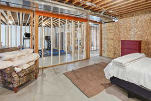 Bedroom with finished concrete flooring