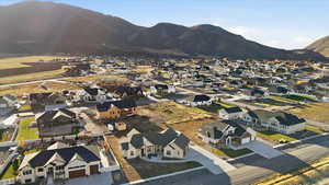 Aerial perspective of suburban area with a mountainous background