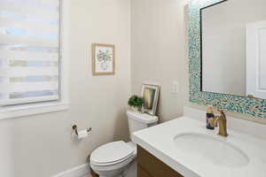 Bathroom featuring vanity and toilet