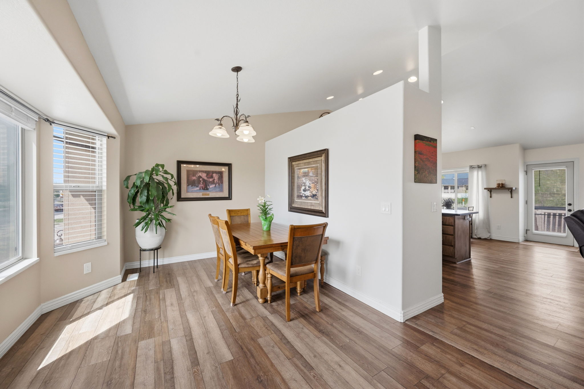 Living room or Formal Dining space with vaulted ceiling and kitchen entrance