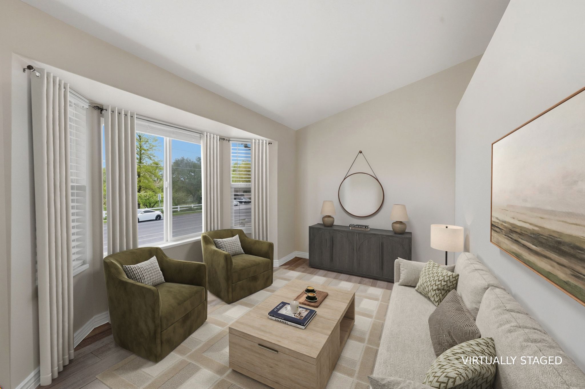 STAGED Living area featuring lofted ceiling