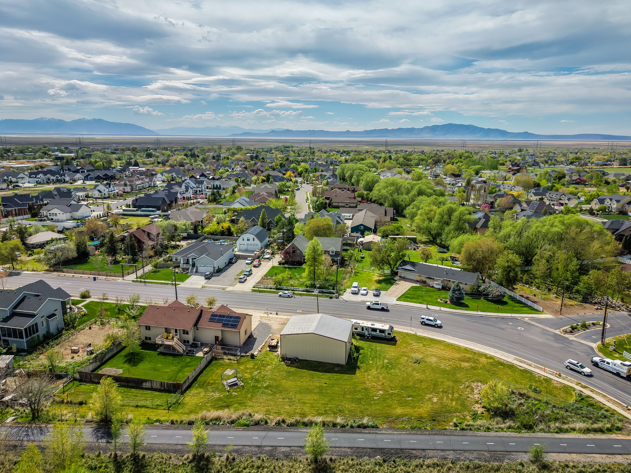 Aerial perspective of suburban area with a mountain backdrop