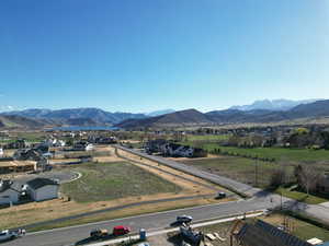 Aerial perspective of suburban area featuring a mountain backdrop