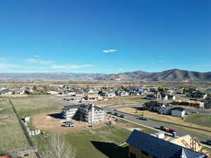 View of mountain backdrop featuring nearby suburban area