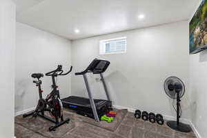 Exercise room featuring carpet floors and recessed lighting