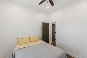 Bedroom with ceiling fan, recessed lighting, and dark wood-type flooring