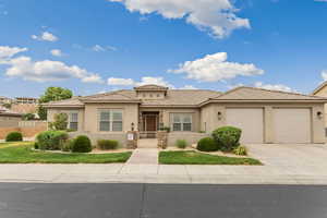 Mediterranean / spanish home with stucco siding, a tiled roof, driveway, and a garage