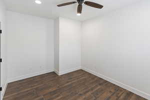 Unfurnished room with dark wood-style flooring, ceiling fan, and recessed lighting