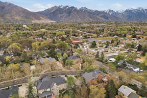 Aerial view of residential area featuring a mountainous background