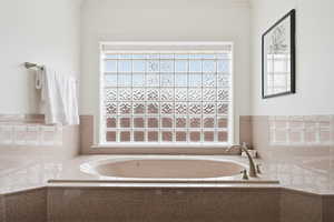 Full bathroom with a garden tub