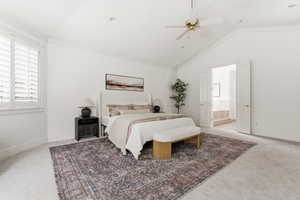 Bedroom featuring carpet flooring, ornamental molding, ceiling fan, and ensuite bathroom