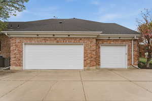 Garage with concrete driveway