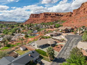 Aerial perspective of suburban area with a mountainous background
