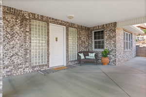 Property entrance with brick siding