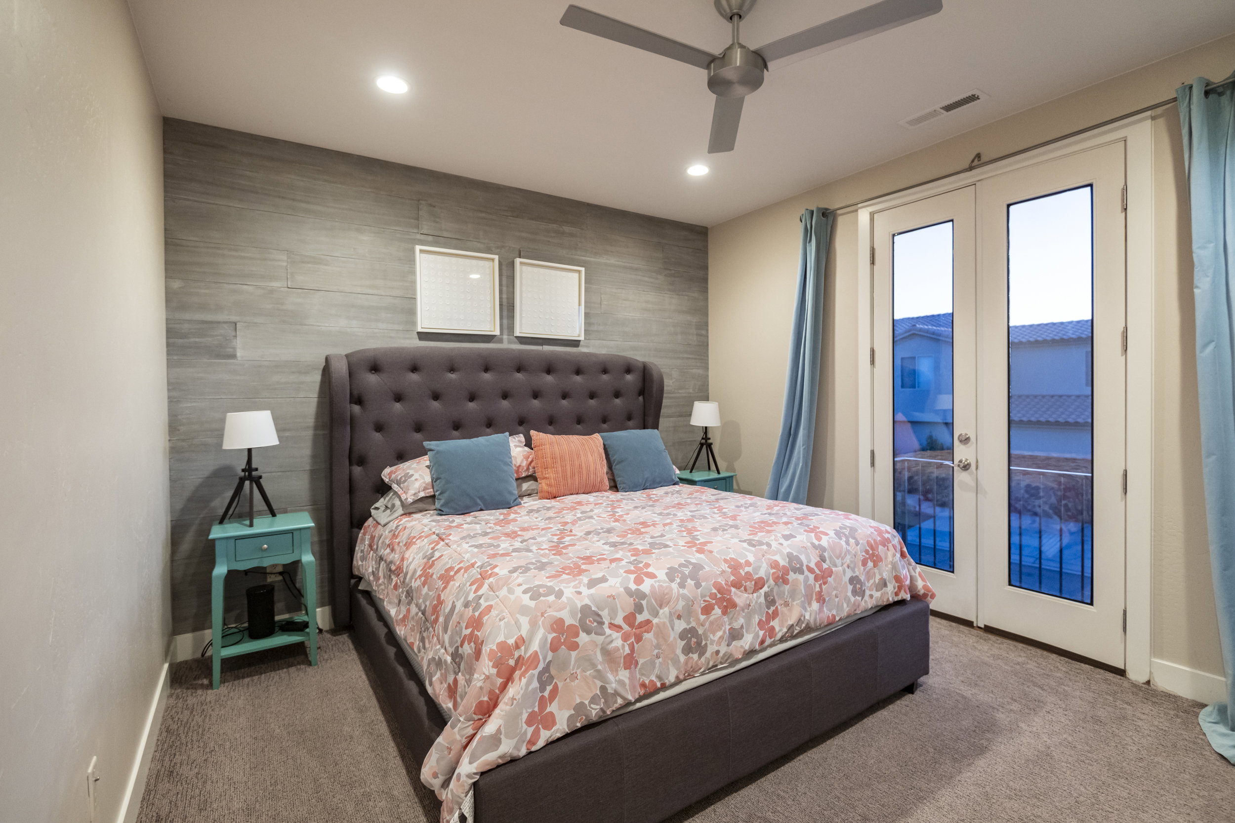 Bedroom with french doors, an accent wall, access to outside, recessed lighting, and carpet flooring