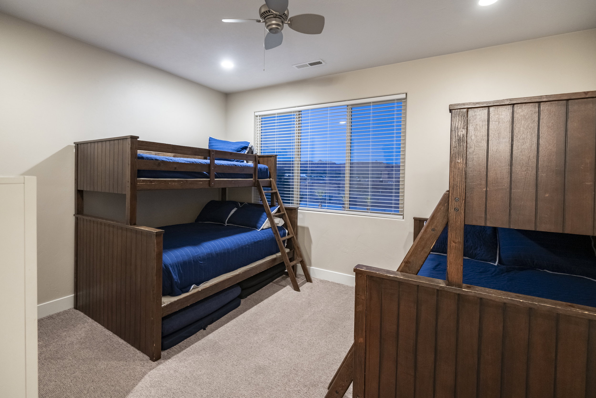 Bedroom featuring a ceiling fan, carpet, and recessed lighting