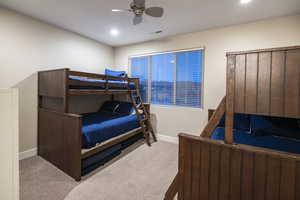 Bedroom featuring a ceiling fan, carpet, and recessed lighting