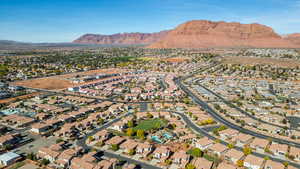 Aerial perspective of suburban area featuring a mountainous background