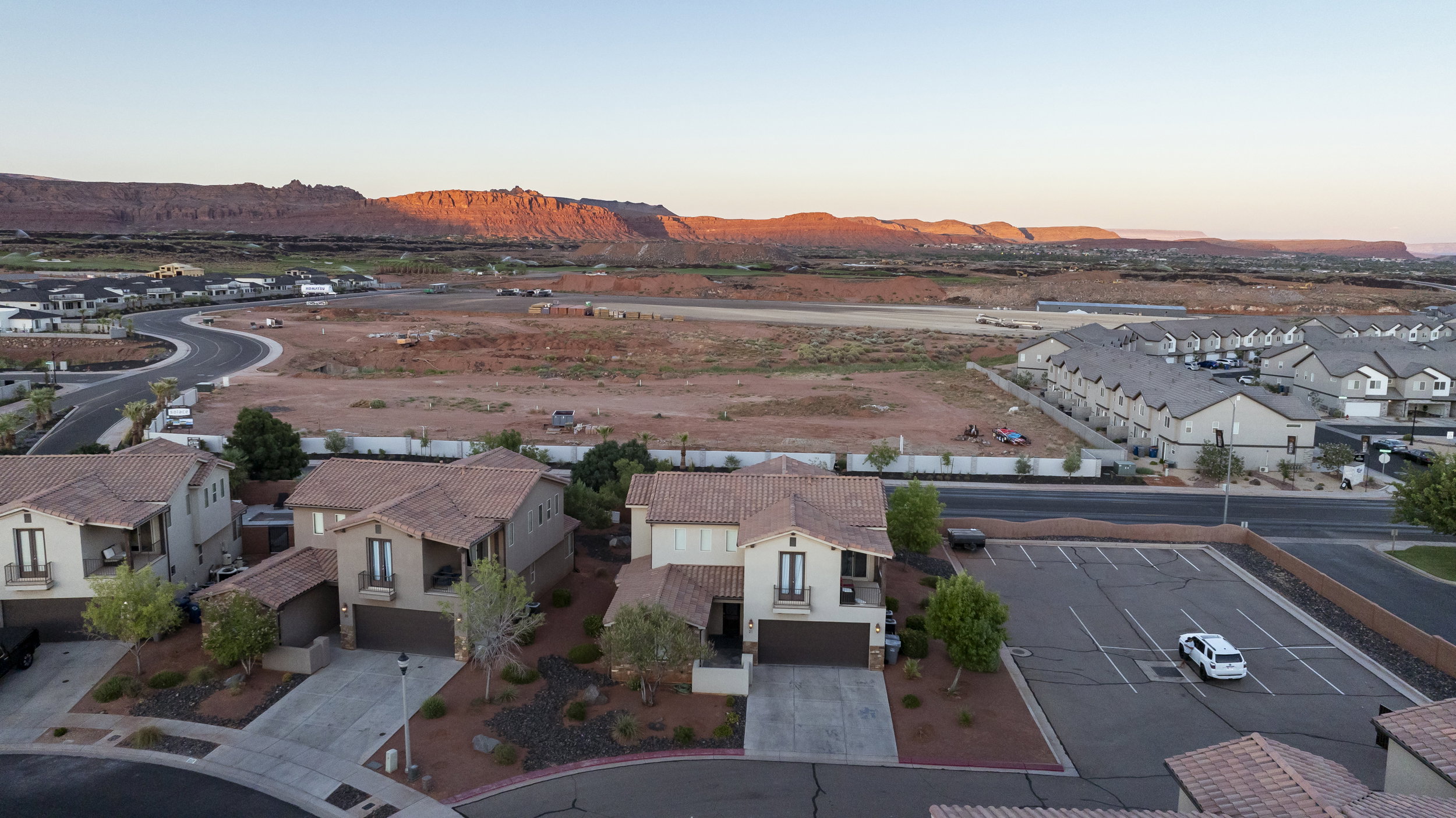 Aerial perspective of suburban area with a mountainous background