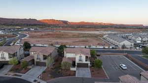 Aerial perspective of suburban area with a mountainous background