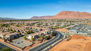 Aerial perspective of suburban area with a mountain backdrop