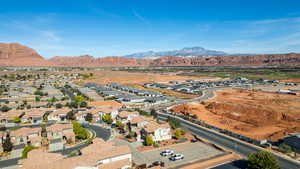 Aerial view of residential area featuring a mountainous background