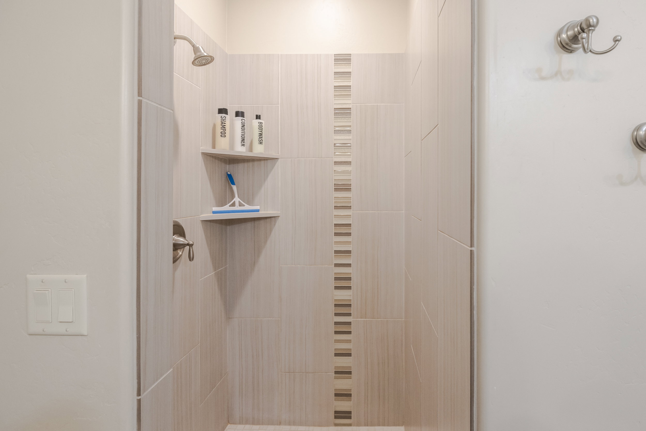 Full bathroom with a shower stall
