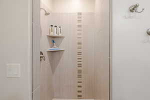 Full bathroom with a shower stall
